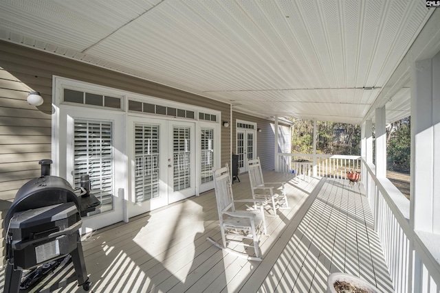 wooden deck with grilling area and french doors