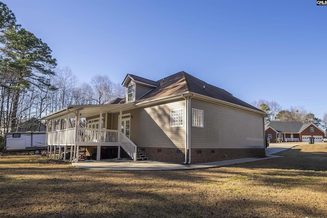 back of property featuring a yard and a patio area