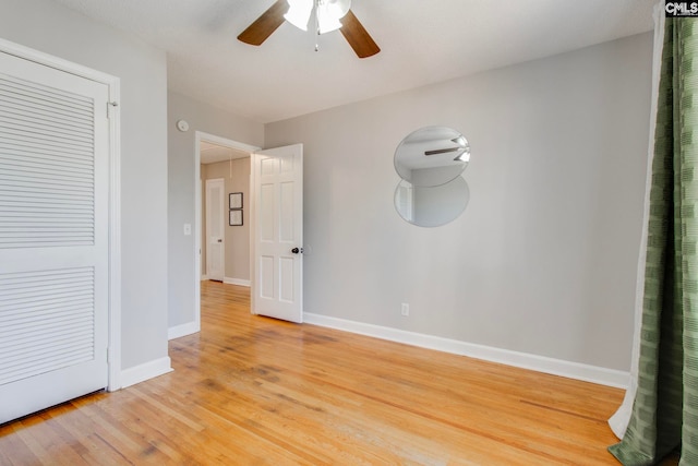 empty room featuring hardwood / wood-style flooring and ceiling fan