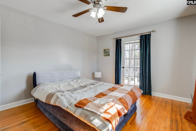 bedroom with wood-type flooring and ceiling fan