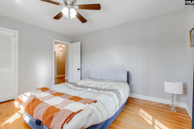 bedroom featuring hardwood / wood-style flooring and ceiling fan