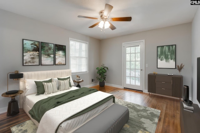 bedroom featuring multiple windows, dark hardwood / wood-style floors, and ceiling fan