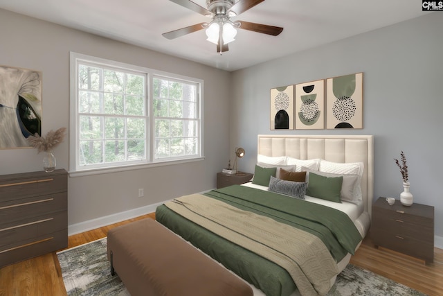 bedroom featuring hardwood / wood-style flooring and ceiling fan