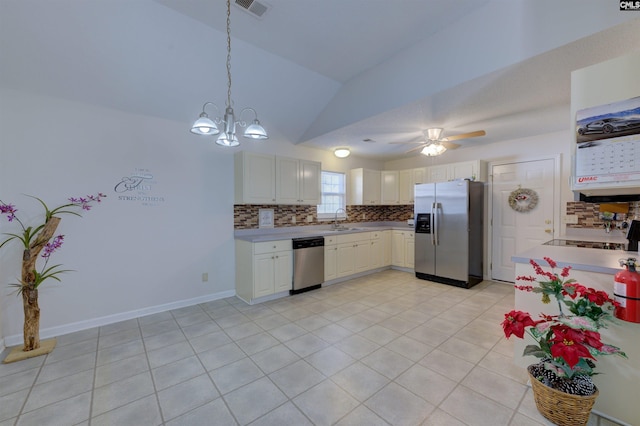 kitchen with sink, hanging light fixtures, white cabinets, and appliances with stainless steel finishes