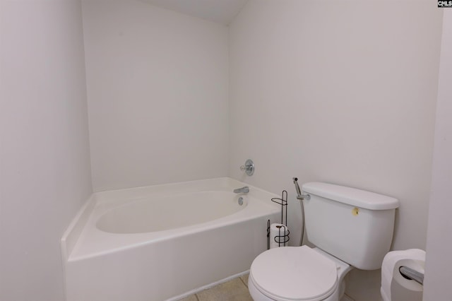 bathroom with a tub and toilet