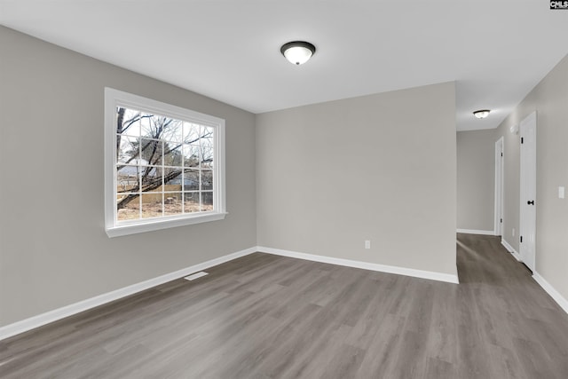 empty room featuring hardwood / wood-style floors