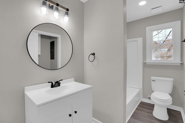 bathroom featuring vanity, toilet, and wood-type flooring