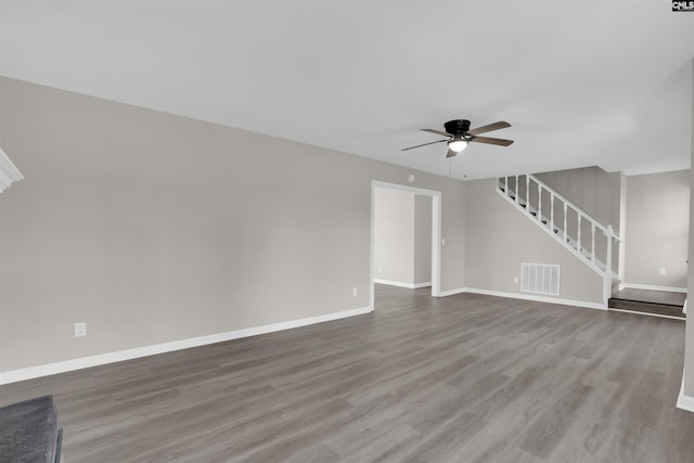 unfurnished living room featuring ceiling fan and hardwood / wood-style floors