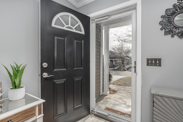 foyer entrance featuring ornamental molding