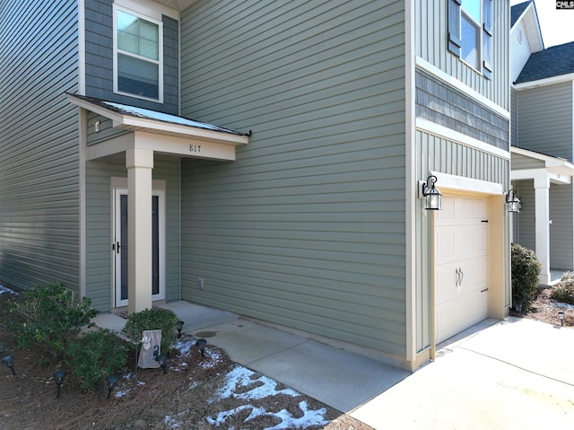 view of exterior entry with a garage