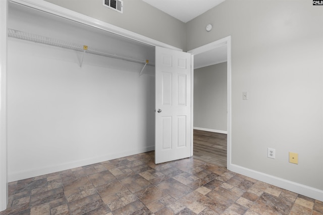 unfurnished bedroom with a closet