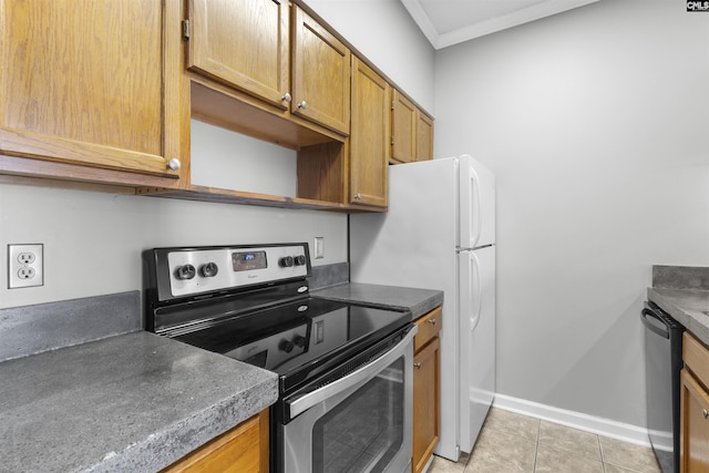 kitchen with crown molding, appliances with stainless steel finishes, and light tile patterned floors