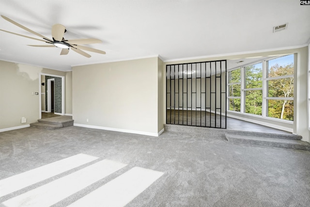 unfurnished living room with crown molding, carpet, and ceiling fan