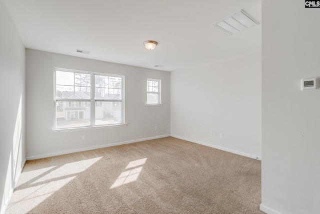 unfurnished room with light colored carpet