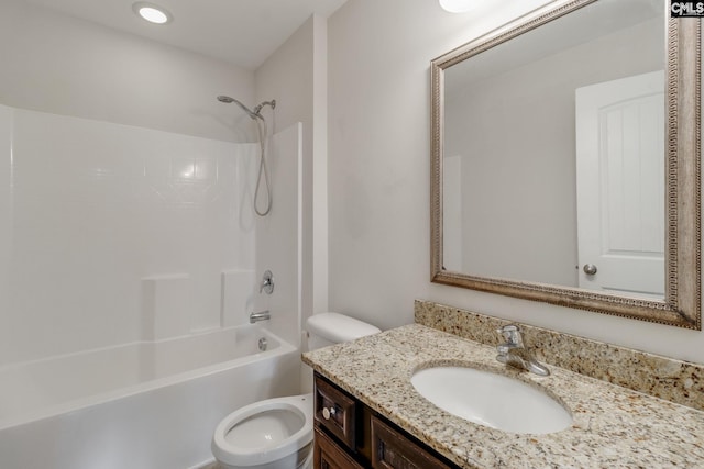 full bathroom featuring vanity, bathtub / shower combination, and toilet