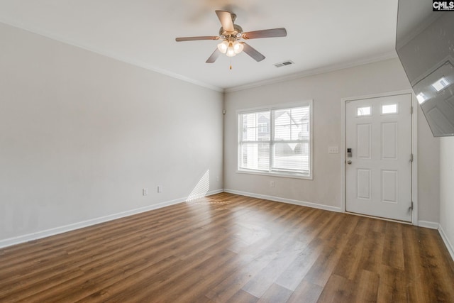 entryway with dark wood-type flooring, ceiling fan, and ornamental molding