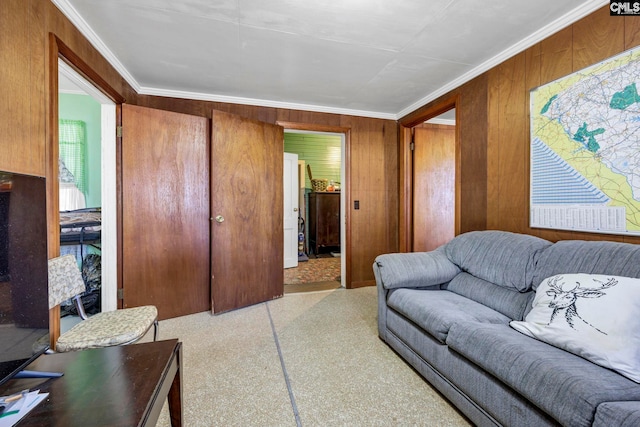 living room featuring ornamental molding and wooden walls