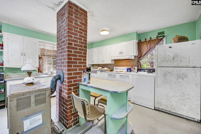 kitchen featuring white cabinetry, washer / clothes dryer, and white fridge