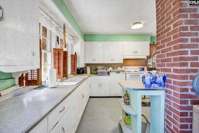 kitchen with white cabinetry, sink, and white electric range oven