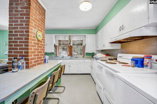 kitchen featuring white cabinetry and white electric range