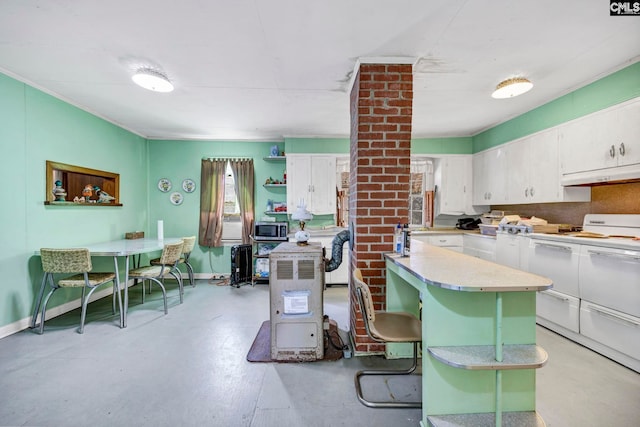 kitchen featuring white cabinetry, a kitchen bar, and a center island