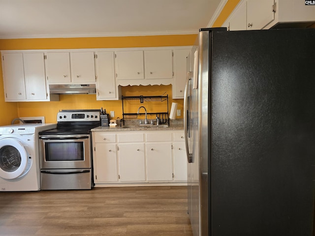 kitchen with appliances with stainless steel finishes, washer / clothes dryer, white cabinetry, sink, and crown molding