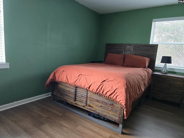 bedroom with wood-type flooring