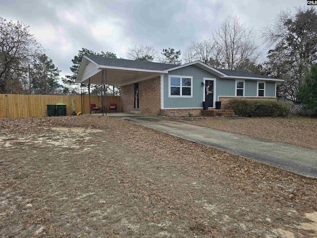 ranch-style home with a carport