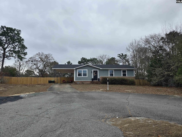 single story home featuring a carport