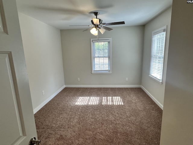 carpeted empty room featuring ceiling fan