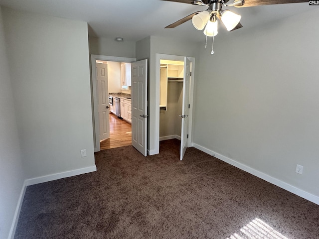 unfurnished bedroom featuring a closet, ceiling fan, and dark colored carpet