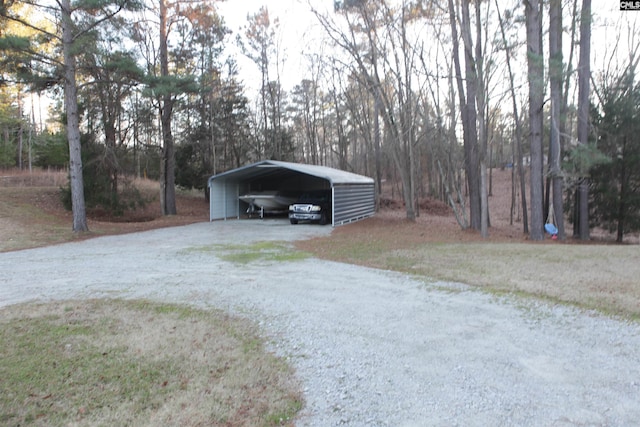 garage featuring a carport