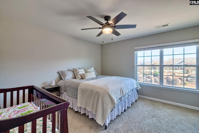 bedroom with ceiling fan and carpet flooring