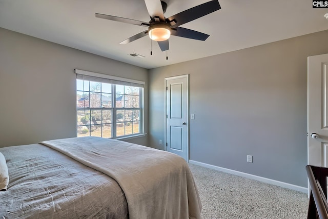 bedroom with ceiling fan and carpet flooring