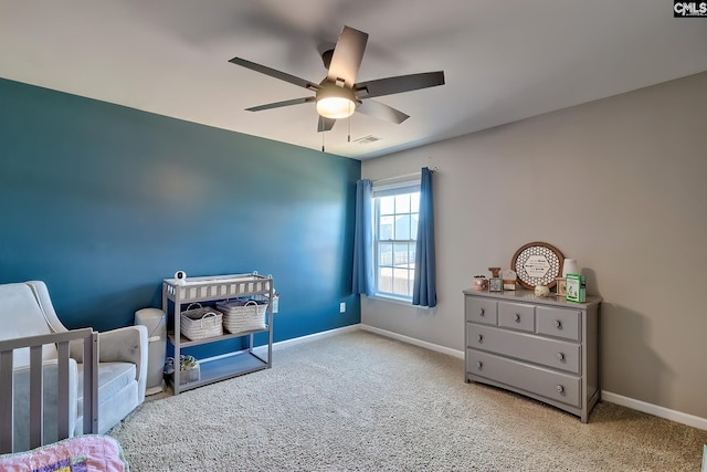 bedroom featuring ceiling fan and light colored carpet