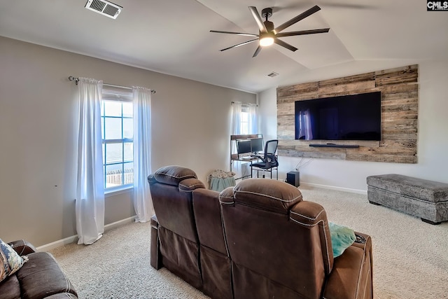 living room with lofted ceiling, plenty of natural light, and carpet flooring