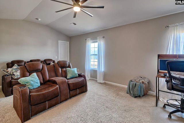 carpeted living room featuring vaulted ceiling and ceiling fan