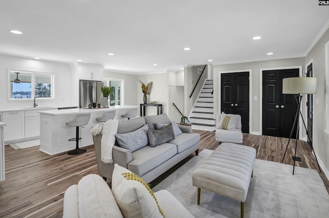 living area featuring recessed lighting and light wood-style flooring