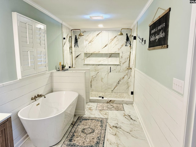 bathroom featuring a wainscoted wall, a marble finish shower, a freestanding bath, crown molding, and marble finish floor