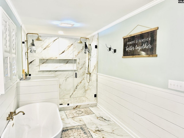 bathroom featuring marble finish floor, ornamental molding, a marble finish shower, wainscoting, and a soaking tub