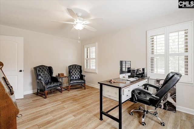 office area featuring light wood finished floors and baseboards