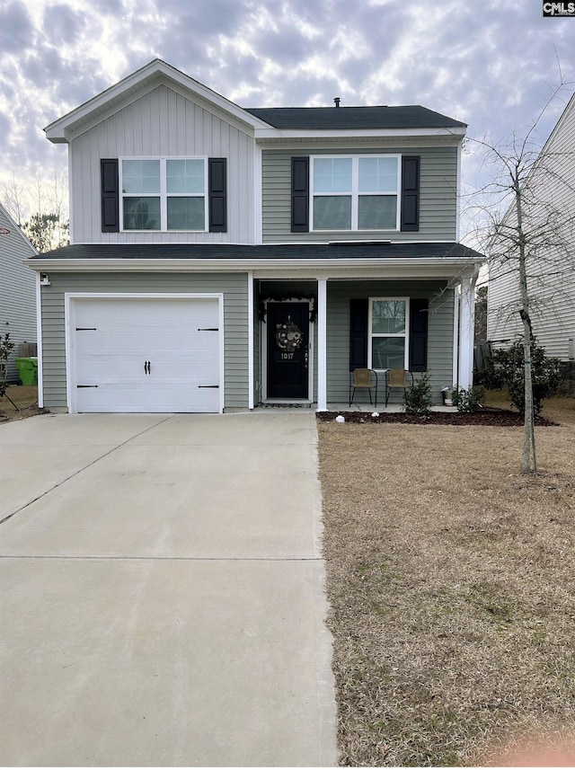 view of front of house with a garage and covered porch