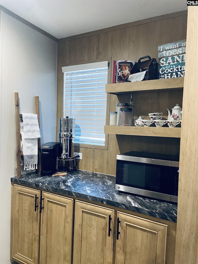 bar with dark stone countertops