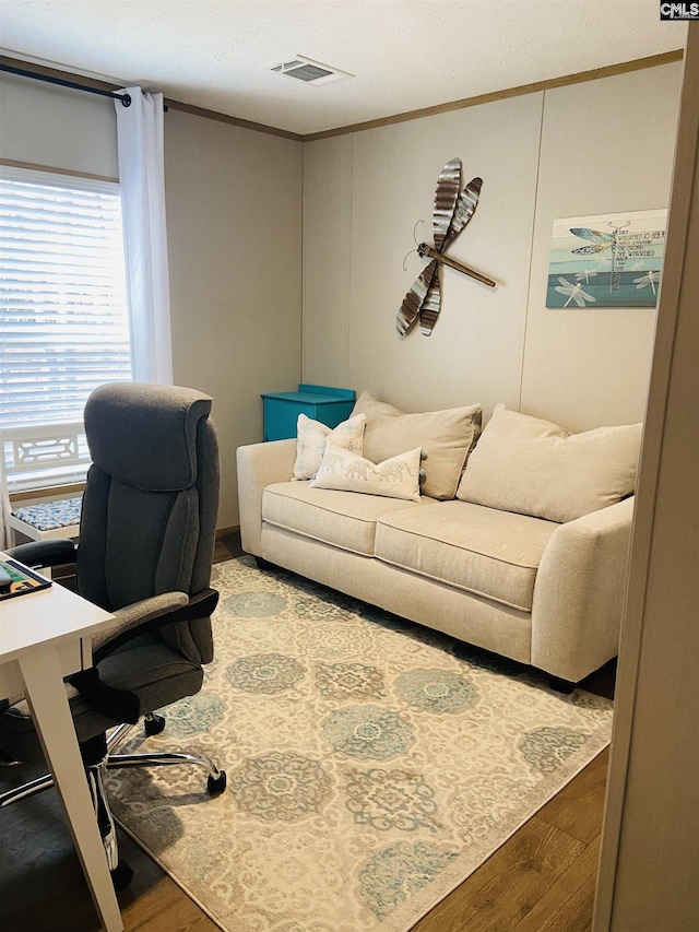 office with crown molding and light wood-type flooring