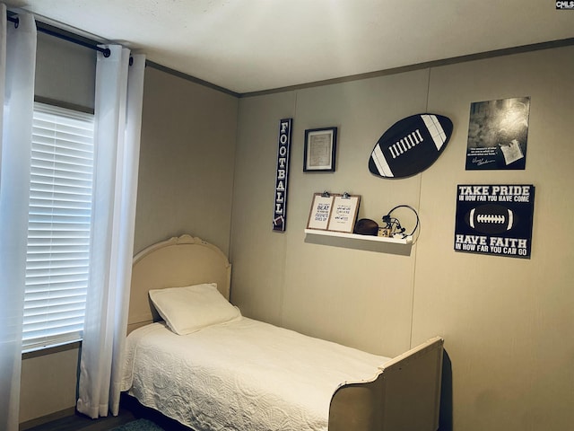 bedroom with ornamental molding