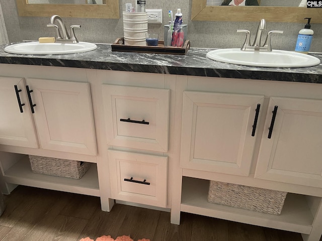 bathroom featuring wood-type flooring, vanity, and backsplash