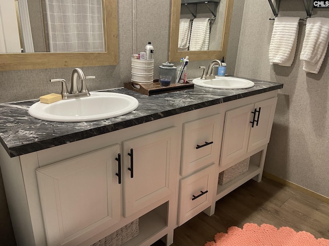 bathroom featuring hardwood / wood-style flooring and vanity