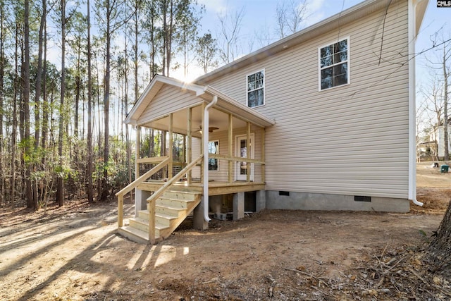 rear view of house with ceiling fan