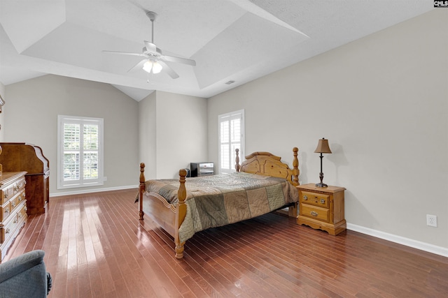 bedroom with vaulted ceiling, hardwood / wood-style floors, and ceiling fan