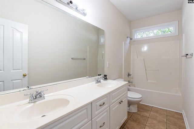 full bathroom with bathing tub / shower combination, vanity, tile patterned floors, and toilet